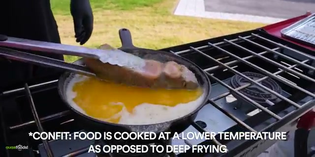 Steak being basted and flipped in the melted garlic sauce in the cast iron, the 