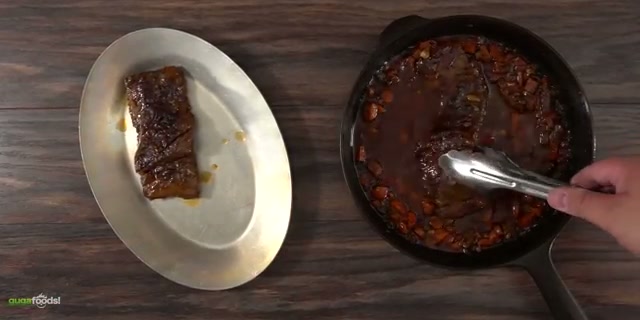 The braised skirt steak falling apart and shredding, showing how tender it got