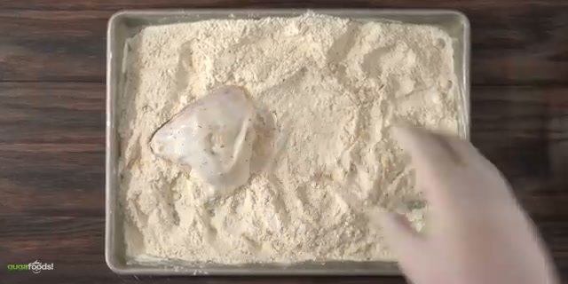 All breaded pieces lined up with even flour coating, ready-to-fry spread