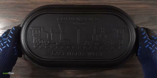 The brisket actively deep frying in bone marrow with visible bubbles, proving th