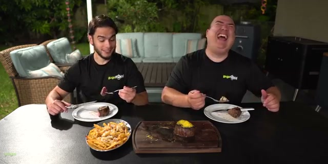 The perfectly sliced medium rare filet mignon with butter melting on top, the mo