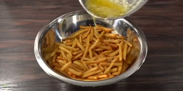 Finished garlic parmesan fries tossed in butter with cheese on top, gorgeous sid