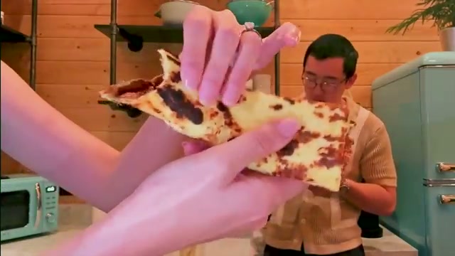 Flatbread being folded to demonstrate its real bread-like flexibility and chewy 